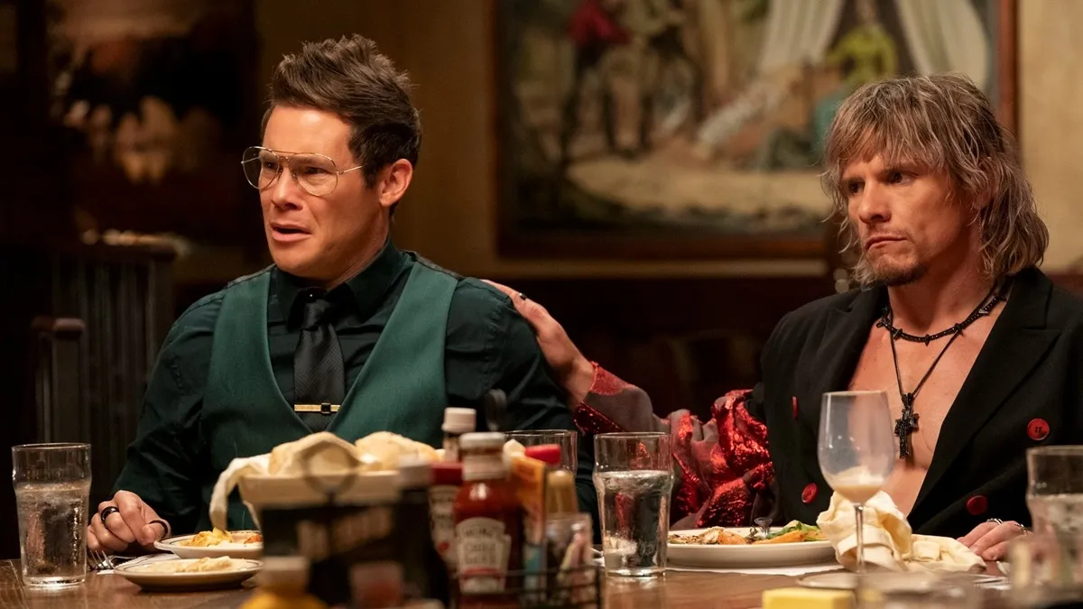 Tony Cavalero's Keefe Chambers touching Adam DeVine's Kelvin Gemstone's arm in The Righteous Gemstones Season 4